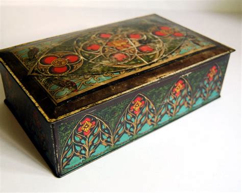 This dramatic vintage tin box by Canco is probably a candy tin (Huylers perhaps) from the 1940s or earlier. . Canco tin box